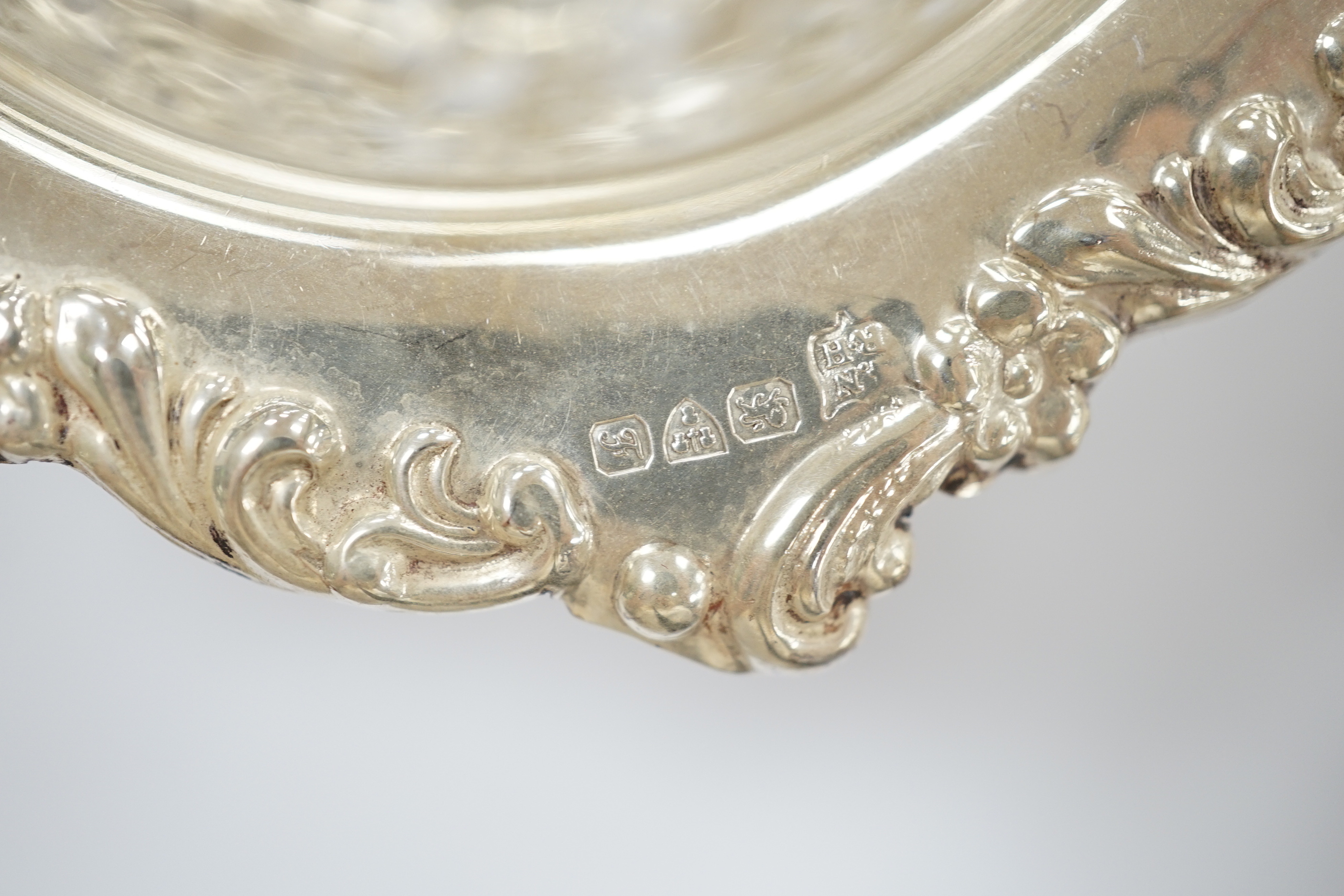Two pairs of early 20th century pierced silver bonbon dishes, largest diameter 12.3cm and a pair of silver mustard pots.